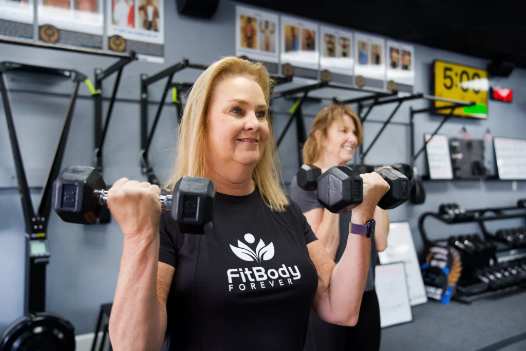 Women lifting weights at Fit Body Boot Camp