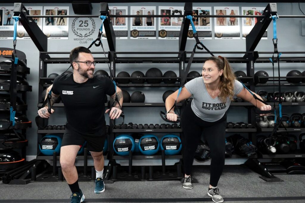 A man and woman exercising at Fit Body Boot Camp