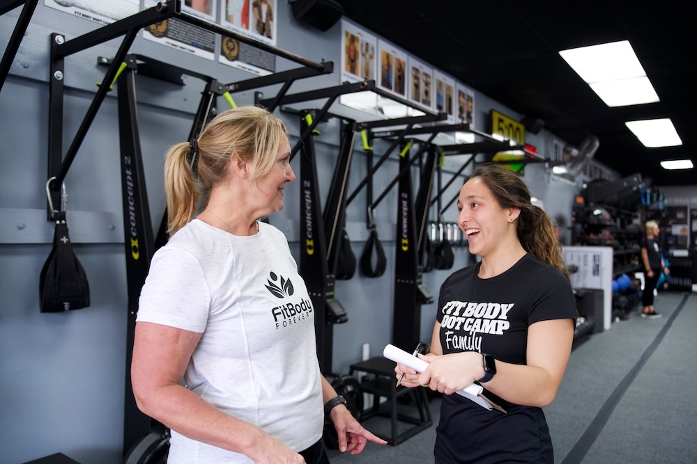 two women talking about the positive effects of working out