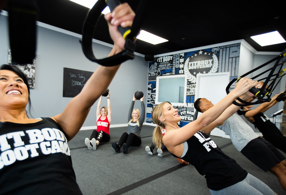 Group of people working out their pulling muscles.