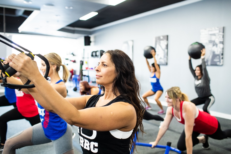 Woman working out in group fitness class.