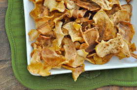 healthy baked apple cinnamon chips piled on a plate