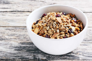 healthy bowl of granola with mixed nuts and dried fruits