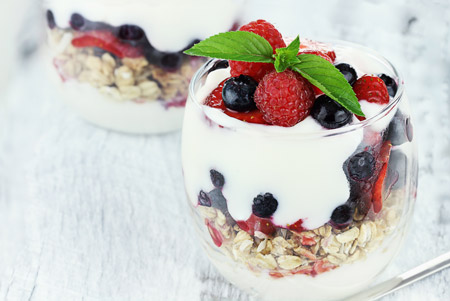 this yogurt parfait with fruit and granola satisfies your sweet tooth in a healthy way